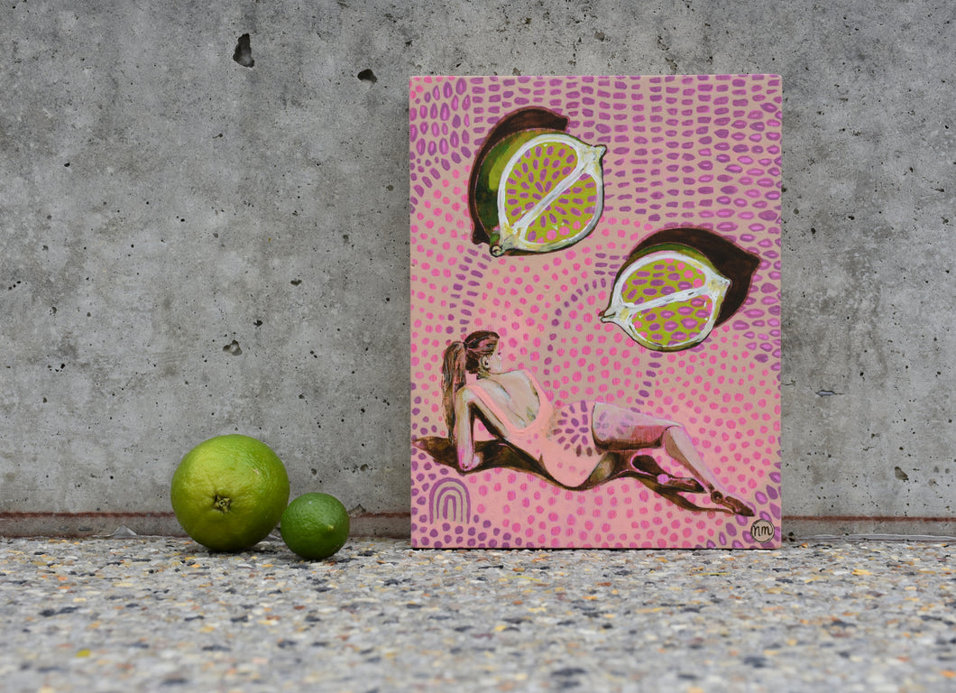 Woman laying on her side positioned under two halves of a lime. An original painting by West Australian artist Natasha Mott.