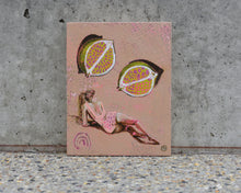 Load image into Gallery viewer, Woman in soft pink bikini laying on her side below a cut lime on a a neutral background. An original painting by West Australian artist Natasha Mott.
